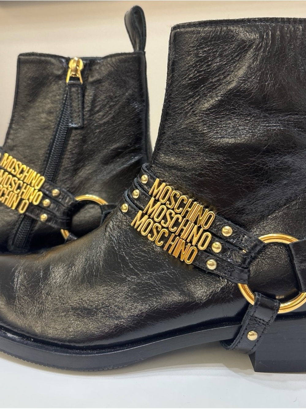 Never worn Moschino Black Leather Ankle Boots with Gold Logo Straps - Picture 3 of 6